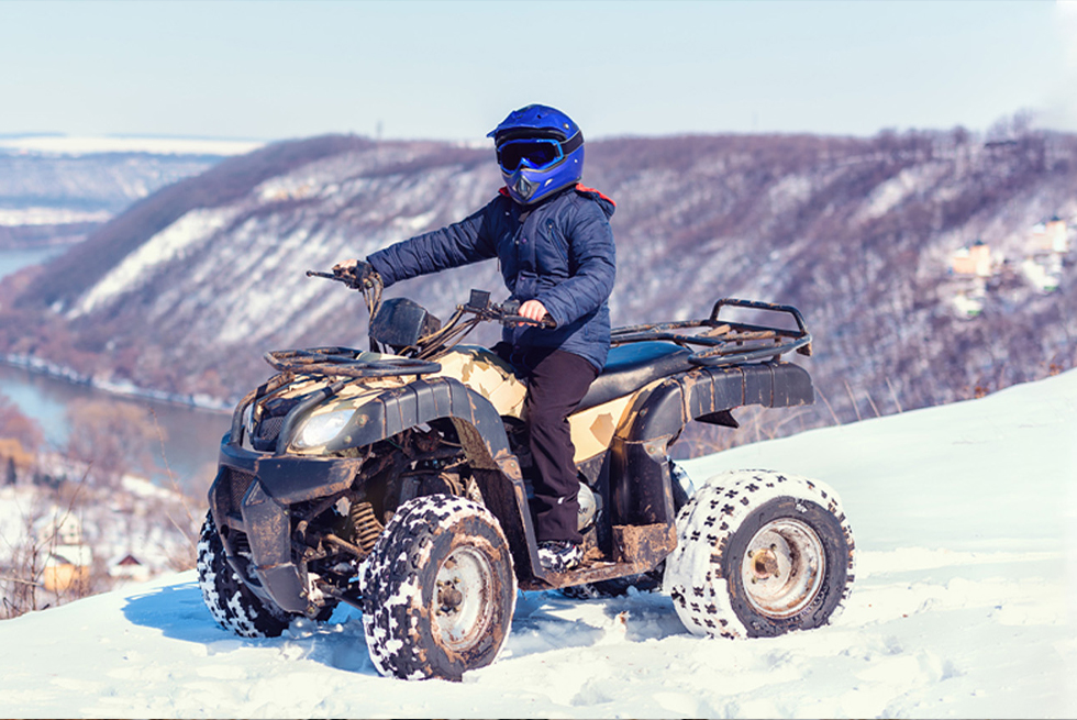 Guy on atv in winter
